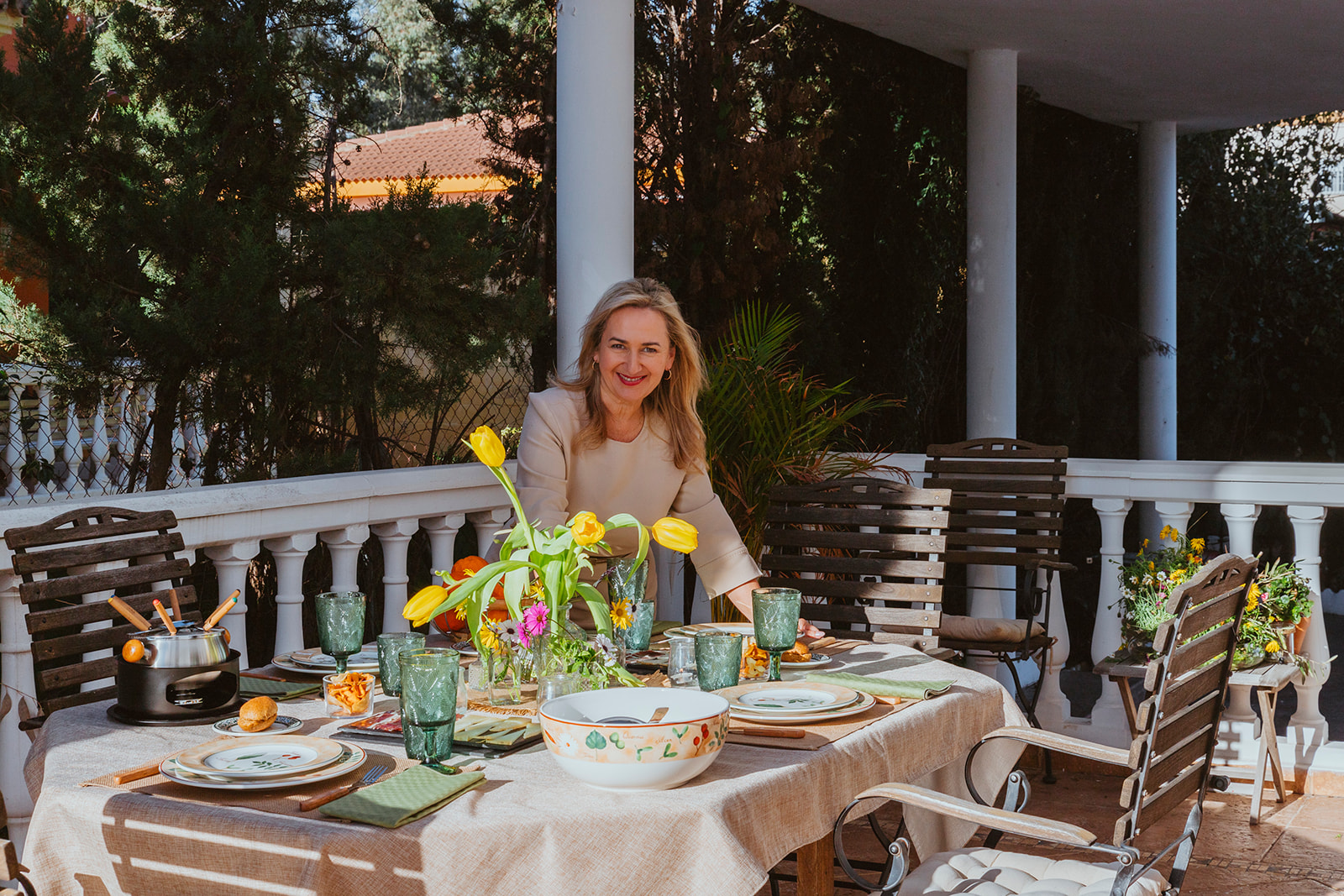 Ana welcomes her guests on the terrace of her wonderful house